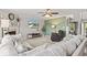 Comfortable living room featuring a large couch, fireplace, and modern ceiling fan at 8635 Nolan Dr, Fishers, IN 46038