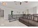 Carpeted loft space featuring a comfortable leather sofa and natural light at 8635 Nolan Dr, Fishers, IN 46038