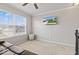 Carpeted loft space with TV and abundant natural light at 8635 Nolan Dr, Fishers, IN 46038