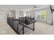 Carpeted loft space featuring a comfortable leather sofa and natural light at 8635 Nolan Dr, Fishers, IN 46038
