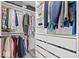 Walk-in closet featuring custom shelving, hanging racks, and storage drawers at 8635 Nolan Dr, Fishers, IN 46038