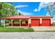Newer red garage with two bays and covered porch at 893 W 500 S, Anderson, IN 46013