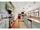 Spacious open kitchen with stainless steel appliances, custom cabinets and a view into the living room at 893 W 500 S, Anderson, IN 46013