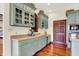 Custom eat-in kitchen with hardwood floors, and a stained glass window accent at 893 W 500 S, Anderson, IN 46013