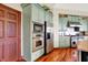 Eat-in kitchen with custom cabinets, stainless steel appliances, and a built-in microwave and oven at 893 W 500 S, Anderson, IN 46013