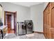 Laundry room equipped with stainless steel washer and dryer with views of the interior at 893 W 500 S, Anderson, IN 46013