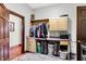 Spacious laundry room with folding counter, hanging rack, and storage shelves at 893 W 500 S, Anderson, IN 46013