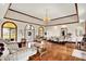Expansive open living and dining area with hardwood floors, ornate lighting, and stylish furnishings at 893 W 500 S, Anderson, IN 46013