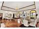 Open living area with hardwood floors, ornate lighting, and access to formal dining and sitting areas at 893 W 500 S, Anderson, IN 46013