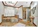 Elegant bathroom with glass shower, sconce lighting, large tub with tiled surround at 893 W 500 S, Anderson, IN 46013