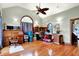 Home office with hardwood floors, multiple desks, lots of lighting, and large arched windows at 893 W 500 S, Anderson, IN 46013