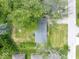 Aerial view of property with mature trees, lawn and side street at 953 W Clinton St, Danville, IN 46122
