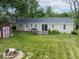 The backyard features a small deck, shed, and generous green space at 953 W Clinton St, Danville, IN 46122