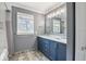 Stylish bathroom with double vanity, marble countertop, updated fixtures, and shower-tub combo at 953 W Clinton St, Danville, IN 46122