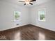 Inviting bedroom with wood-look floors, bright windows, and a peaceful ambiance at 953 W Clinton St, Danville, IN 46122