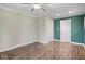 Spacious bedroom with ceiling fan, wood-look flooring, and a closet for ample storage at 953 W Clinton St, Danville, IN 46122