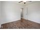 Simple bedroom featuring modern flooring, white walls, and a closet for storage at 953 W Clinton St, Danville, IN 46122