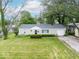 A bird's eye view of a beautiful single-story home with an attached garage at 953 W Clinton St, Danville, IN 46122
