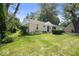 Charming single-story home with a well-manicured front lawn and attached garage at 953 W Clinton St, Danville, IN 46122