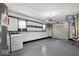 Spacious garage featuring painted floors, lots of storage, and washer/dryer at 953 W Clinton St, Danville, IN 46122