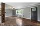 Spacious living room with beautiful hardwood floors and ample natural light at 953 W Clinton St, Danville, IN 46122