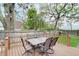 Back deck featuring a seating area with table and chairs and a fenced yard at 1009 Broadway St, Indianapolis, IN 46202