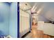 Bathroom featuring a laundry area, shower with white curtain, and sink with vanity at 1009 Broadway St, Indianapolis, IN 46202