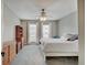 Bright bedroom with natural light, neutral walls, and a ceiling fan, creating a serene atmosphere at 1009 Broadway St, Indianapolis, IN 46202