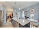 Light and airy kitchen with a large island and modern finishes at 1009 Broadway St, Indianapolis, IN 46202