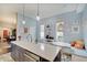 Well-lit kitchen with center island and cozy breakfast nook, great for entertaining and enjoying meals at 1009 Broadway St, Indianapolis, IN 46202