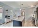 Bright kitchen with an island, eat-in breakfast nook, and stainless steel appliances at 1009 Broadway St, Indianapolis, IN 46202