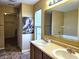 Bathroom with dual sinks and large framed mirror at 10836 Zimmerman Ln, Indianapolis, IN 46231
