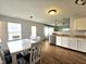 Bright eat-in kitchen boasts stainless steel appliances and wooden flooring at 10836 Zimmerman Ln, Indianapolis, IN 46231