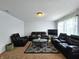 This living room features cozy seating, a modern TV, and ample natural light at 10836 Zimmerman Ln, Indianapolis, IN 46231