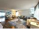 Bright living room showcasing modern decor, a stylish rug, hardwood floors, and contemporary furniture at 10836 Zimmerman Ln, Indianapolis, IN 46231