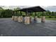 Community pavilion featuring stone columns, picnic tables, and ample space for gatherings at 10836 Zimmerman Ln, Indianapolis, IN 46231