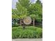 Bent Wood entrance sign featuring a maple leaf in a wooded, landscaped community setting at 10836 Zimmerman Ln, Indianapolis, IN 46231