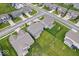 An aerial view showcases homes with large manicured lawns and mature trees at 10993 Liberation Trce, Noblesville, IN 46060