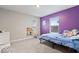 Comfortable bedroom featuring a playful purple wall, with a window view and cute decor at 10993 Liberation Trce, Noblesville, IN 46060