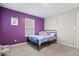 Comfortable bedroom featuring a playful purple wall, with a window view and cute decor at 10993 Liberation Trce, Noblesville, IN 46060