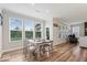 Bright dining room with large windows, a dining table, and a backyard view at 10993 Liberation Trce, Noblesville, IN 46060