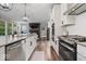 Modern kitchen features stainless appliances, white cabinets, granite countertops, and a gas range at 10993 Liberation Trce, Noblesville, IN 46060