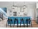 Kitchen island with breakfast bar, pendant lighting, pantry, and stainless appliances at 10993 Liberation Trce, Noblesville, IN 46060