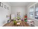 Bright playroom with large window, whiteboard, toys, and stylish wood floors at 10993 Liberation Trce, Noblesville, IN 46060