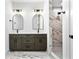 Modern bathroom with double vanity, stylish mirrors, and a marble-tiled shower at 1100 English Ave, Indianapolis, IN 46203