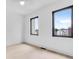Bright bedroom with modern windows, hardwood floors, and a ceiling fan at 1100 English Ave, Indianapolis, IN 46203