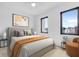 Cozy bedroom with a comfortable bed, stylish artwork, and plenty of natural light at 1100 English Ave, Indianapolis, IN 46203