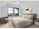 Comfortable bedroom with a large bed, stylish decor, and natural light at 1100 English Ave, Indianapolis, IN 46203