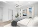 Serene bedroom with two bright windows dressed in sheer curtains and a modern ceiling light at 1100 English Ave, Indianapolis, IN 46203