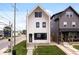 Modern two-story home with white siding, black trim, and well-manicured lawn at 1100 English Ave, Indianapolis, IN 46203